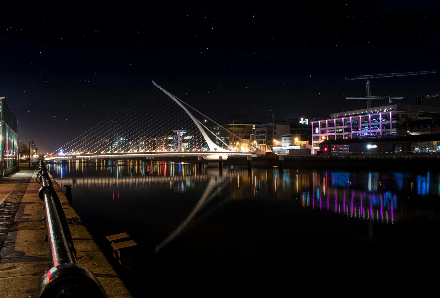 Samuel Beckett Bridge reflected in the River Liffey at night
